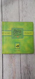A square green journal or notebook titled 'Scalpers' by Laura Walsh, placed flat on a light gray wood plank surface.